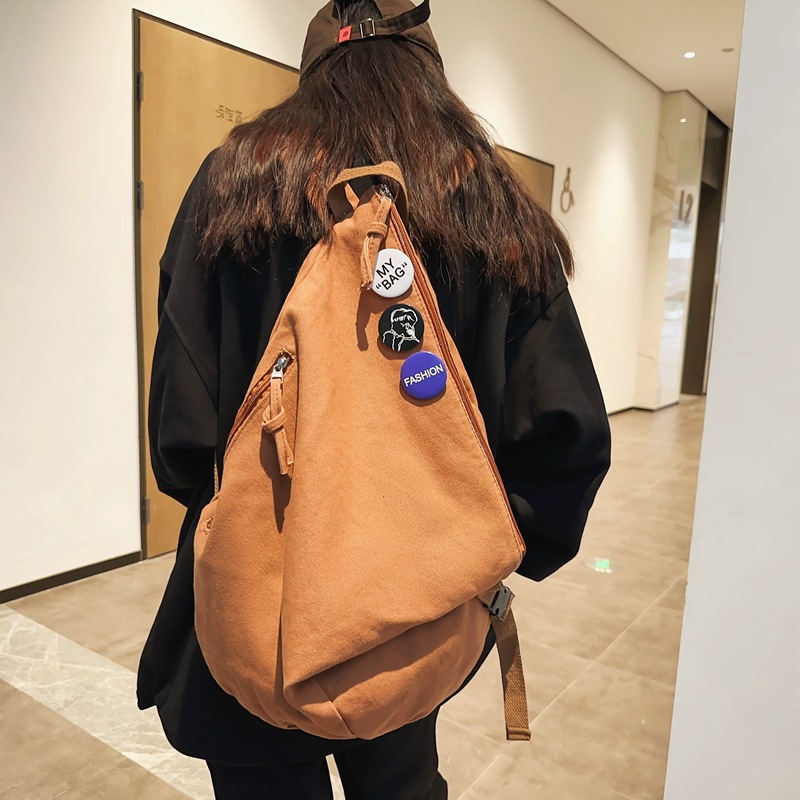 双肩包男大学生简约日系原宿帆布背包初中生高中生三角折叠书包女
