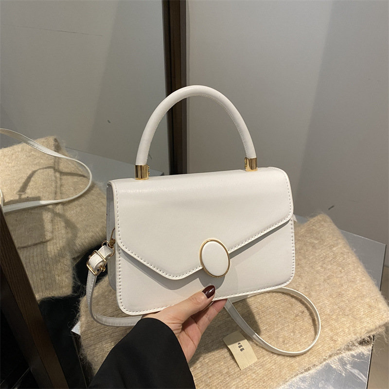 2025 primavera nuevo estilo simple y popular bolso de hombro coreano de color sólido simple bolso de literatura y arte para mujeres