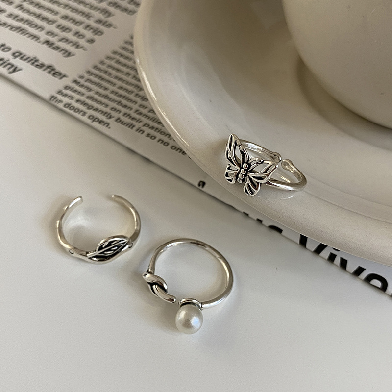 Retro Pearl Three-piece Ring Female Butterfly Leaf Silver Plated Copper Ring display picture 1