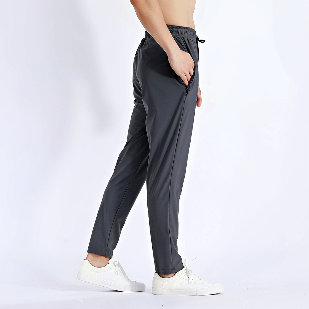 Pantalones deportivos de hombre para correr Fitness rápido secado respirado con cremallera bolsillo suelto gran tamaño de nylon hielo pantalones de cintura alta
