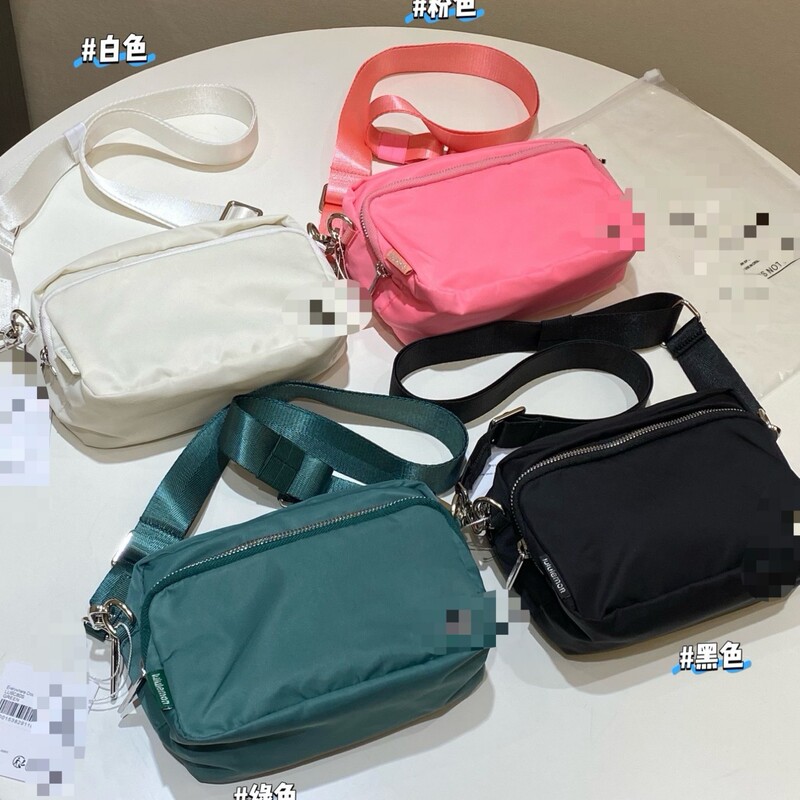 Lu Lu's 2L crossbody bag with multiple compartments, a unisex camera bag, a versatile chest bag, and a lightweight commuter shoulder bag
