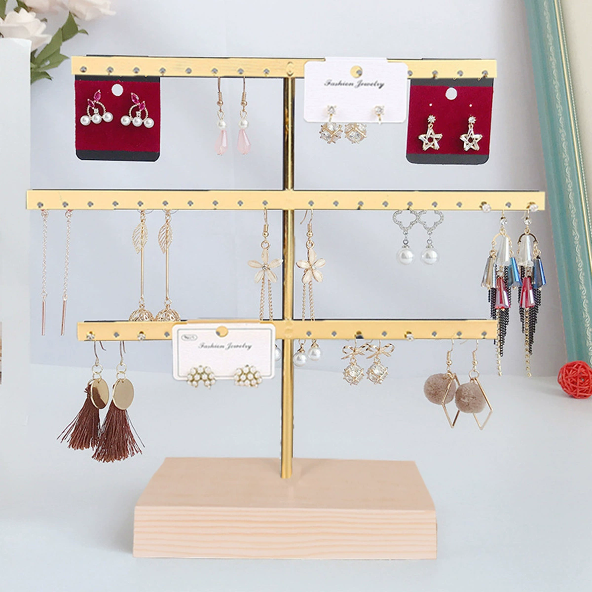 Earrings, golden stand, storage system