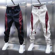春秋款新款男款裤子潮牌小脚九分裤拼接男裤红色休闲裤束脚哈伦裤