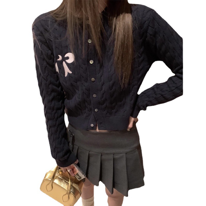 Design autumn cardigan with a round collar with bow