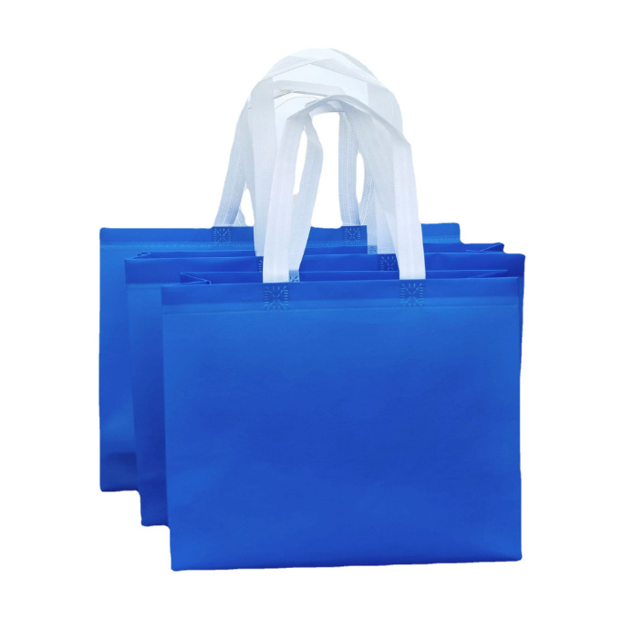 En stock película publicitaria bolso no tejido impermeable protección del medio ambiente ropa zapatos bolso de compras en blanco logotipo impreso