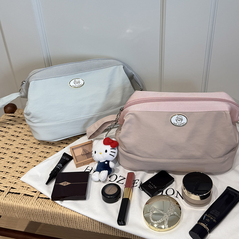 Minimalist, Instagram-worthy, large-capacity, portable makeup and toiletry bag.