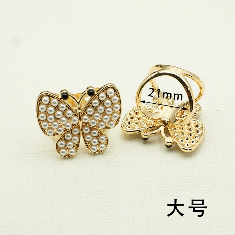 Corea del Sur multi-funcional bufanda hebilla de alta calidad perla moda nueva Camelia windbreaker cinturón hebilla de alta gama joyería al por mayor