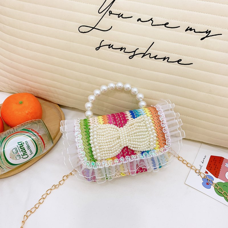 2025 nuevo regalo para niñas para niñas jardín de infantes Día de los niños arco de perla tela de paja bolso de hombro