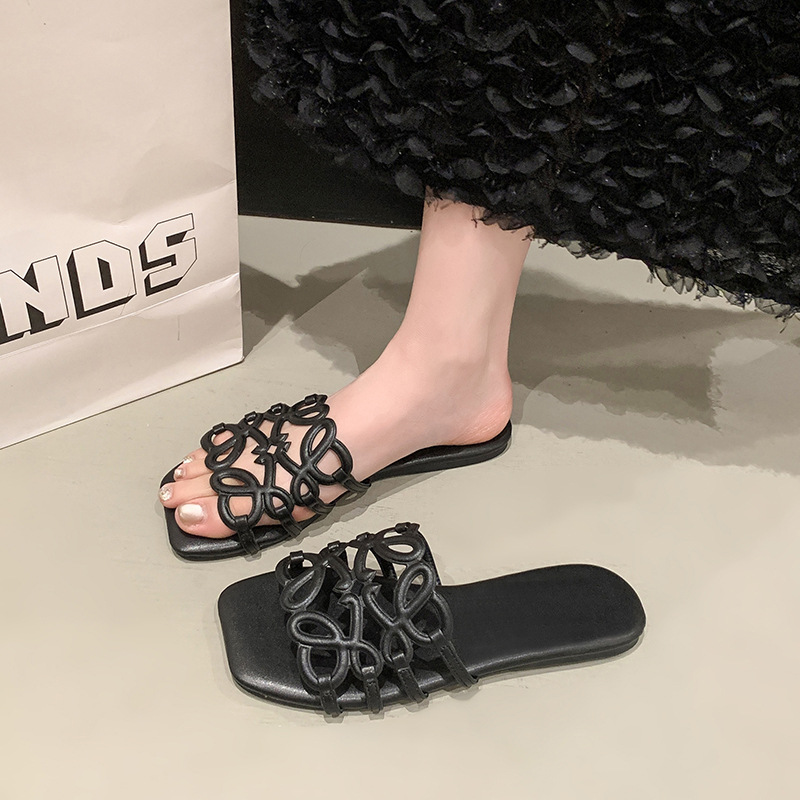 2025 nuevas zapatillas de playa casuales transfronterizas Nigeria Sudeste de Asia 3D calado fondo plano de una sola palabra zapatillas de mujer