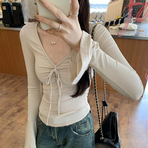 Niche cropped top with flared details, a sexy V-neck design, and sleek long sleeves—perfect for a chic, edgy, and feminine vibe.