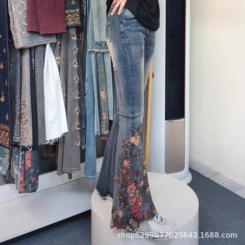 Embroidered denim flared pants for women, 2024 winter new arrival—high-waisted, slim-fit, figure-flattering, ethnic-style, intricately crafted, fleece-lined long pants.