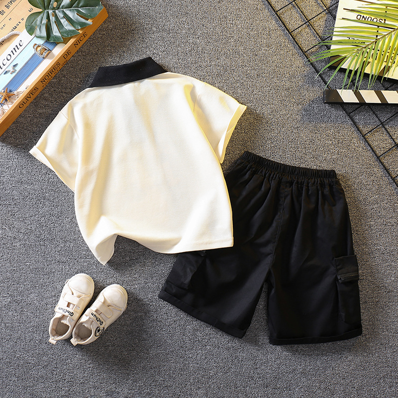 5698 traje de niño 2025 nuevo verano fresco y guapo bebé verano dibujos animados polo manga corta de dos piezas verano para niños