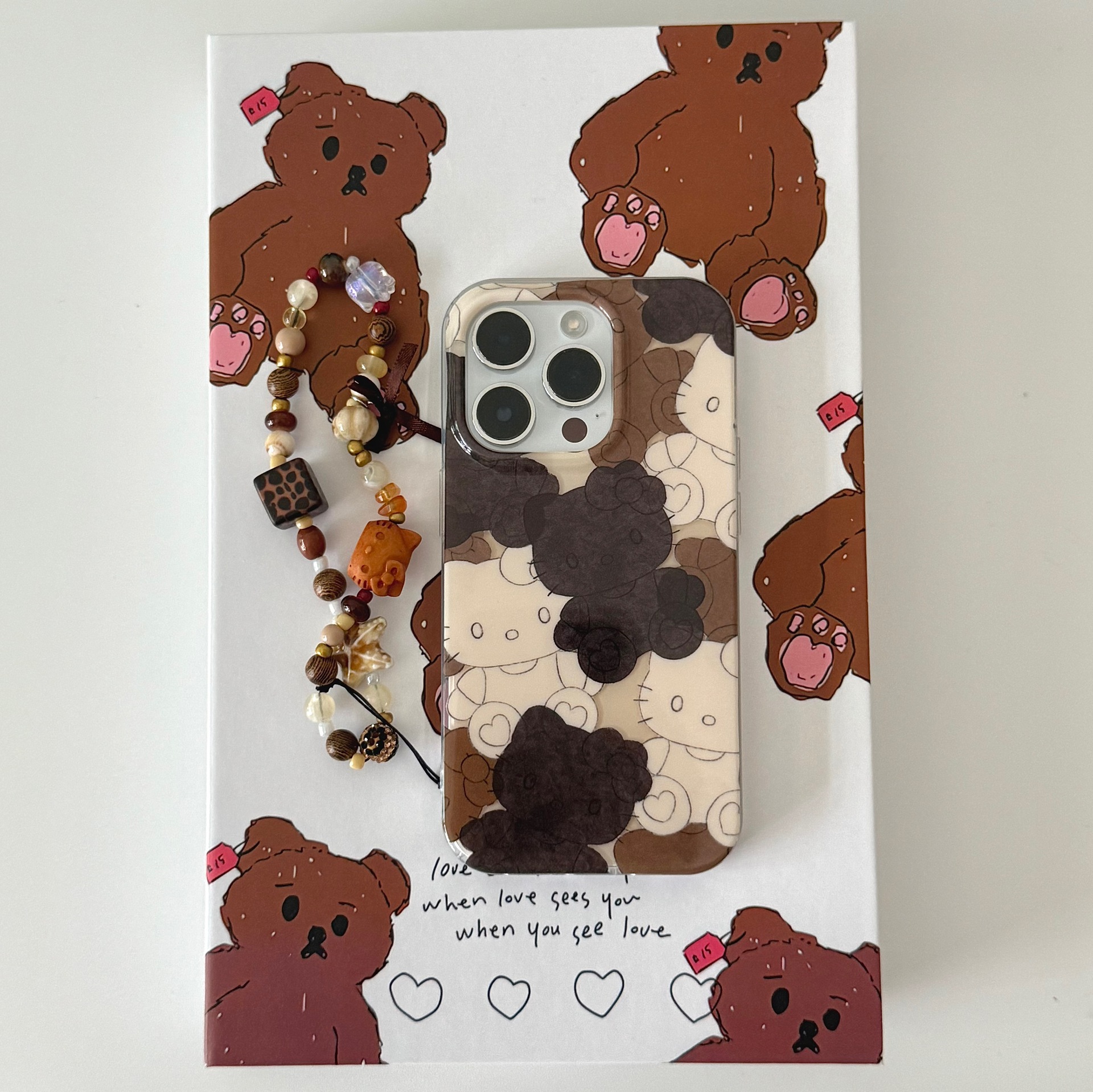 Divertida galleta de dibujos animados KT gato para Apple 16ProMax funda para teléfono móvil 15Pro nicho 14/13 cadena 15PM