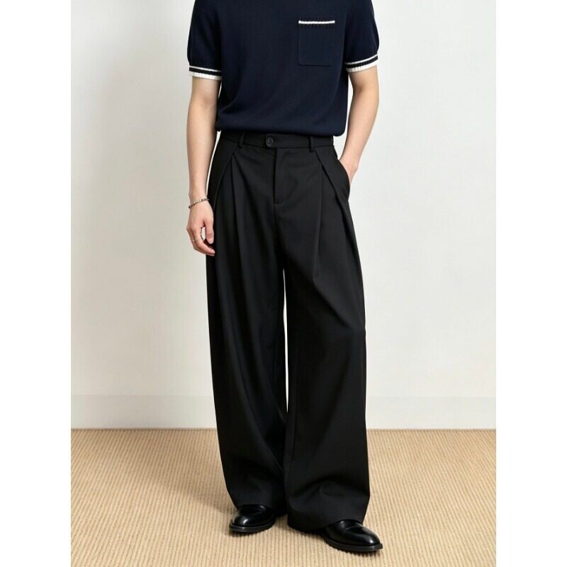 Minimalist neutral style commuter pants 2026, solid color high-waisted pleated bamboo charcoal fiber loose-fitting black trousers with a nice drape