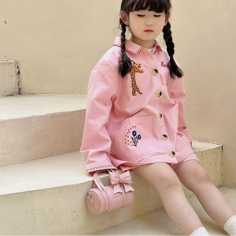 Bolso cilíndrico para niña de color sólido simple bolso de bebé con lazo dulce y lindo 2025 moda mini bolso para niños