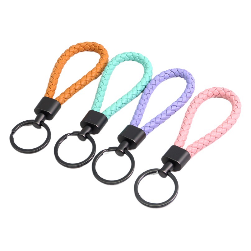 En stock cuerda de cuero tejida de alta calidad llavero de aleación de zinc hebilla llavero colgante de llave de coche al por mayor