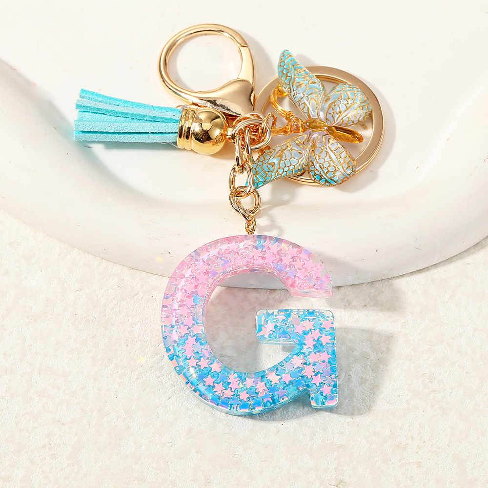 Europa y los Estados Unidos transfronterizos nuevos cristal sequinado goteo de goma letras inglesas joyería llavero y bolsos colgante apoyo al por mayor