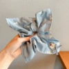 Blue scarf with bow