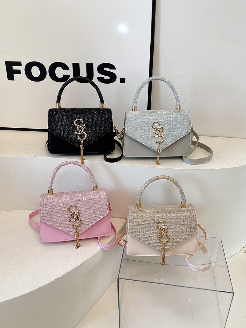Bolso 2026 nuevo bolso de lujo ligero, letras de moda de mujer, color de mano, bolso de hombro simple y versátil