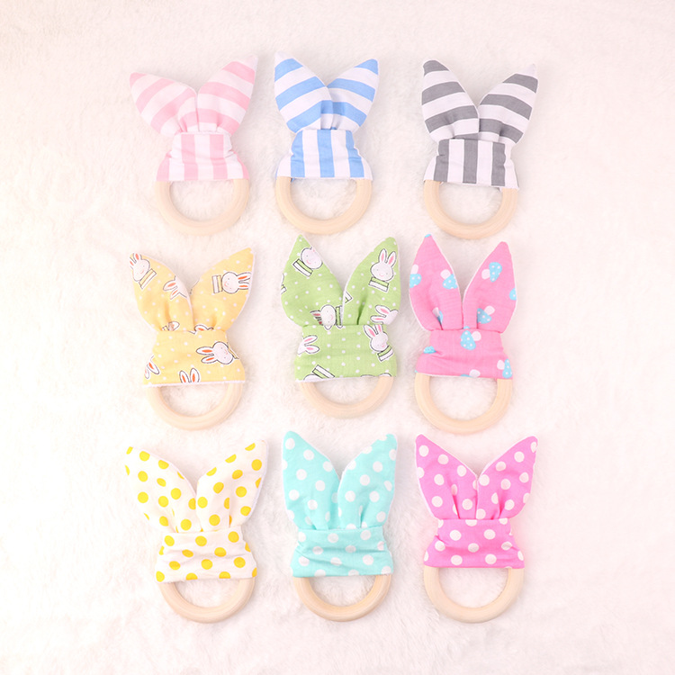 Colorful cotton rabbit ear wooden circle baby teether cross-border foreign trade children's dental practice toy hand wooden circle
