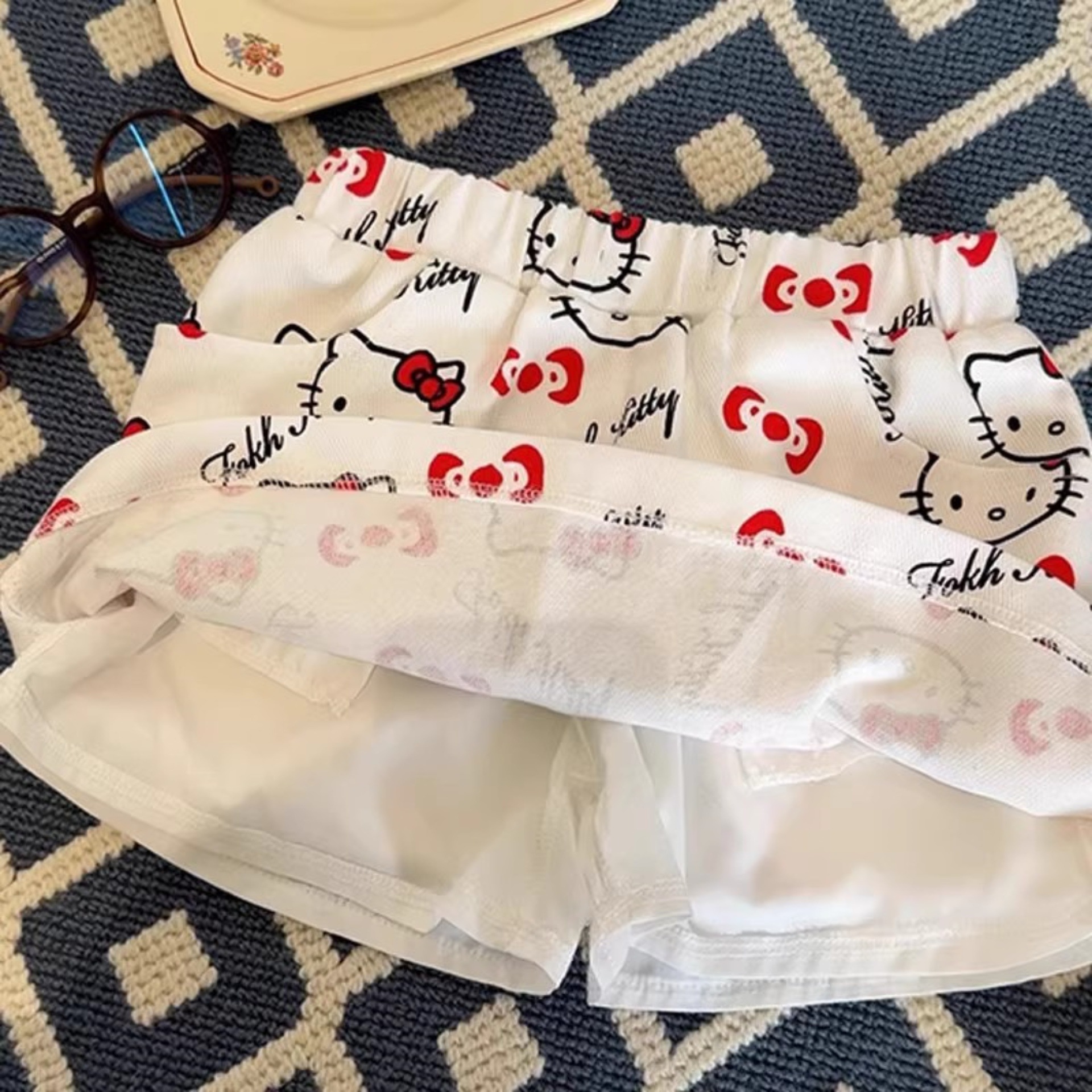 Niña redonda estrella infantil nueva falda corta tesoro femenino verano impresión completa KT gato falda de dibujos animados salvaje estilo occidental celebridad de Internet ropa para niños