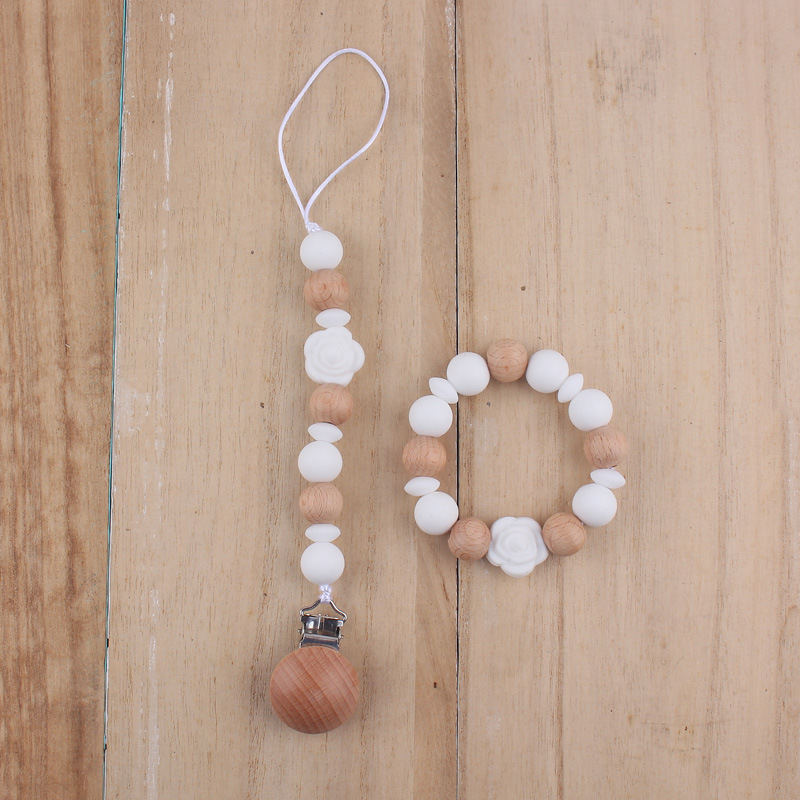 Nuevo bebé de dibujos animados de silicona de doble cara Rosa mordedor calmante bebé anti-gota cadena pulsera traje de juguete