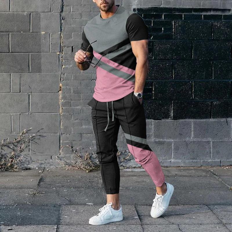男性のスーツの夏の青年の半袖のtシャツのストライプは色のゆったりした弾力の薄い運動のズボンの2つのセットをつづり合わせます。|undefined