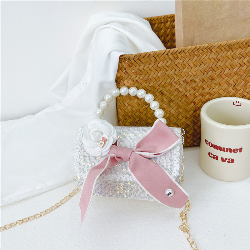 Bolso de los nuevos niños al por mayor bolso de princesa Linda pequeña flor arco accesorios bolsa versátil bolsa de mensajero de las muchachas