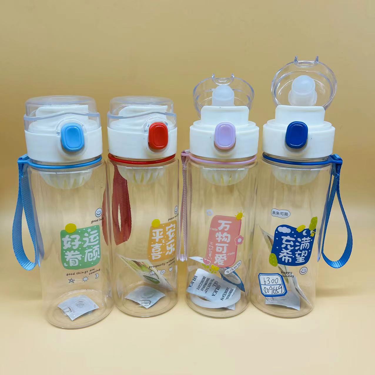 Cubierta de rebote estudiante pequeña capacidad deportes portátil 600ml té perfumado taza portátil rebote taza de agua de plástico con mango