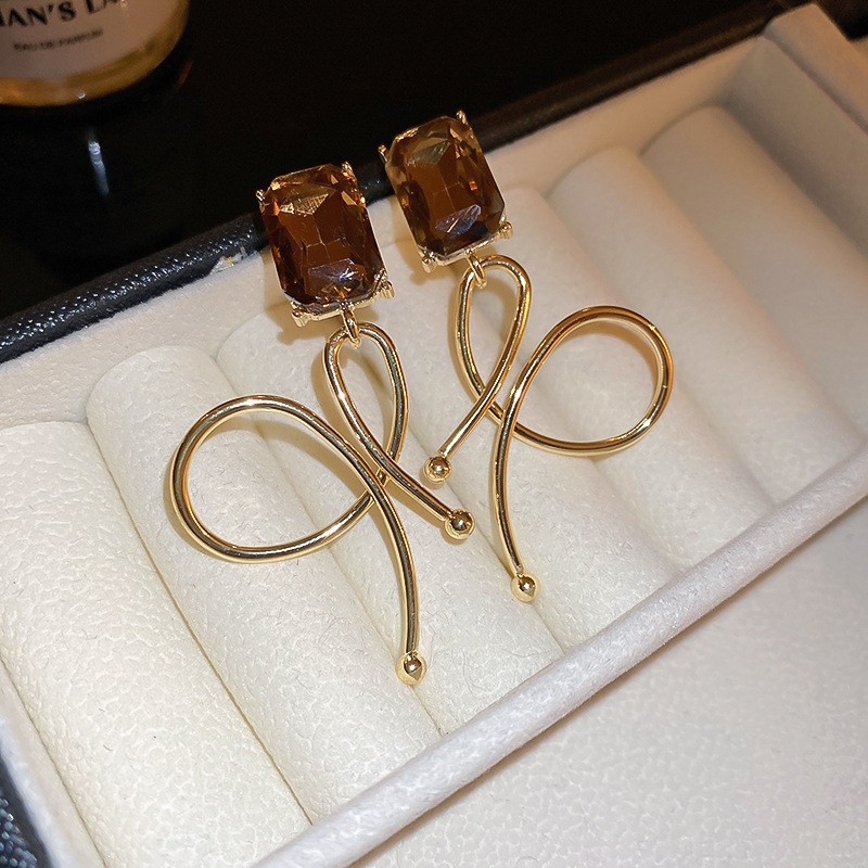 Aguja de plata Pendientes de lazo de diamantes coreanos Pendientes de temperamento de moda de todo fósforo Pendientes de diseño de nicho Sentido de lujo ligero