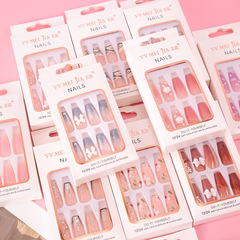 Mid-to-long length, ready-to-wear nail tips with transparent base and rhinestone accents—trendy nail art stickers available in wholesale quantities, reusable, and perfect for extending nails.