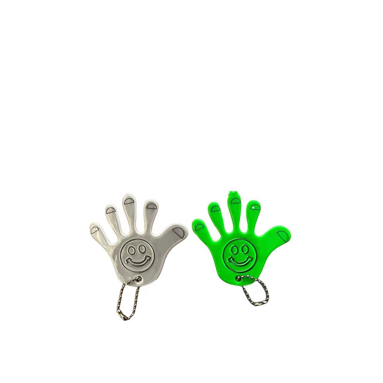 Fuente de fabricación sonriente creativa palma de PVC colgante reflectante bolsos accesorios colgantes