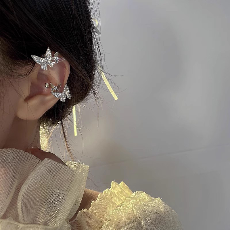 Diseño de nicho de alta gama borla larga sin orejas clip de oreja elegante estilo occidental de las mujeres cara-mirando pequeños nuevos pendientes de moda