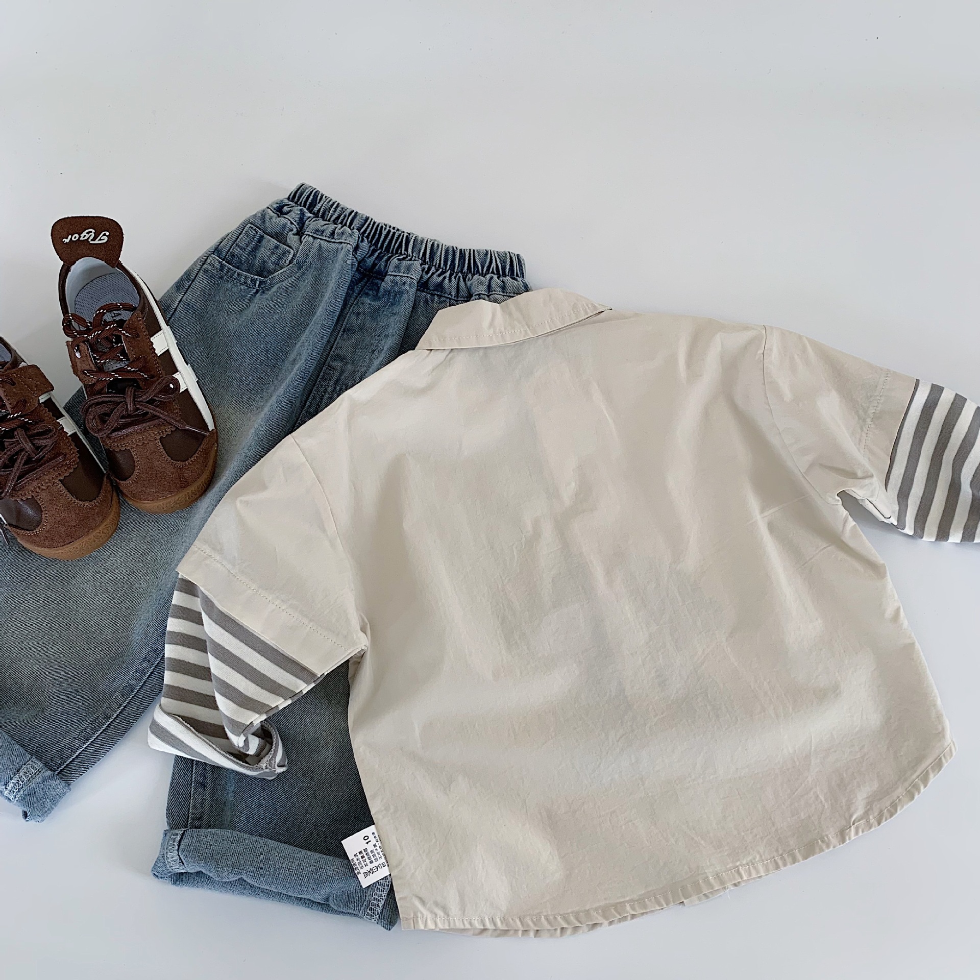 Camisas infantiles Mai Bao 2025, otoño nuevo estilo coreano de dibujos animados para bebés masculinos y femeninos, camisas falsas de dos piezas para niños primavera y otoño