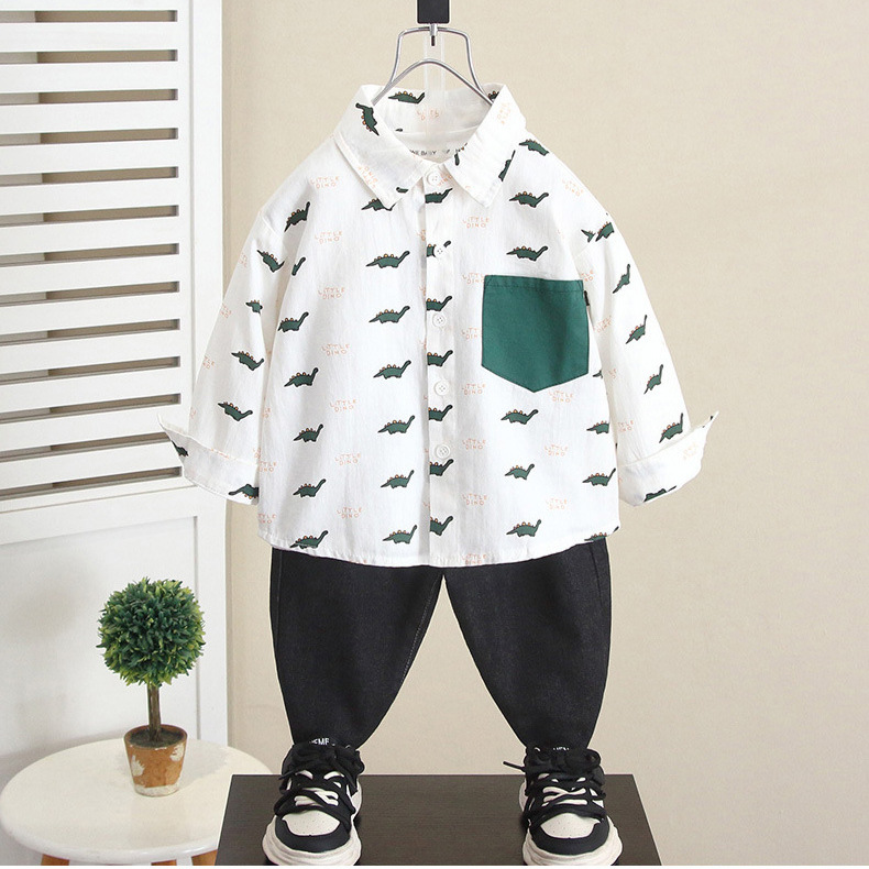 6268 Camisa de dinosaurio de dibujos animados para niños Otoño 2025 Nuevo estilo guapo bebé primavera y otoño Camisa de manga larga para niños