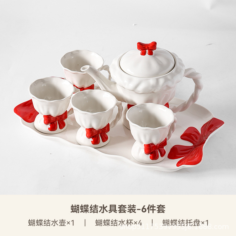Una olla de cerámica, cuatro tazas de juego de té, caja de regalo de inauguración de la casa, lazo pintado a mano, taza de té de la tarde, regalo de boda