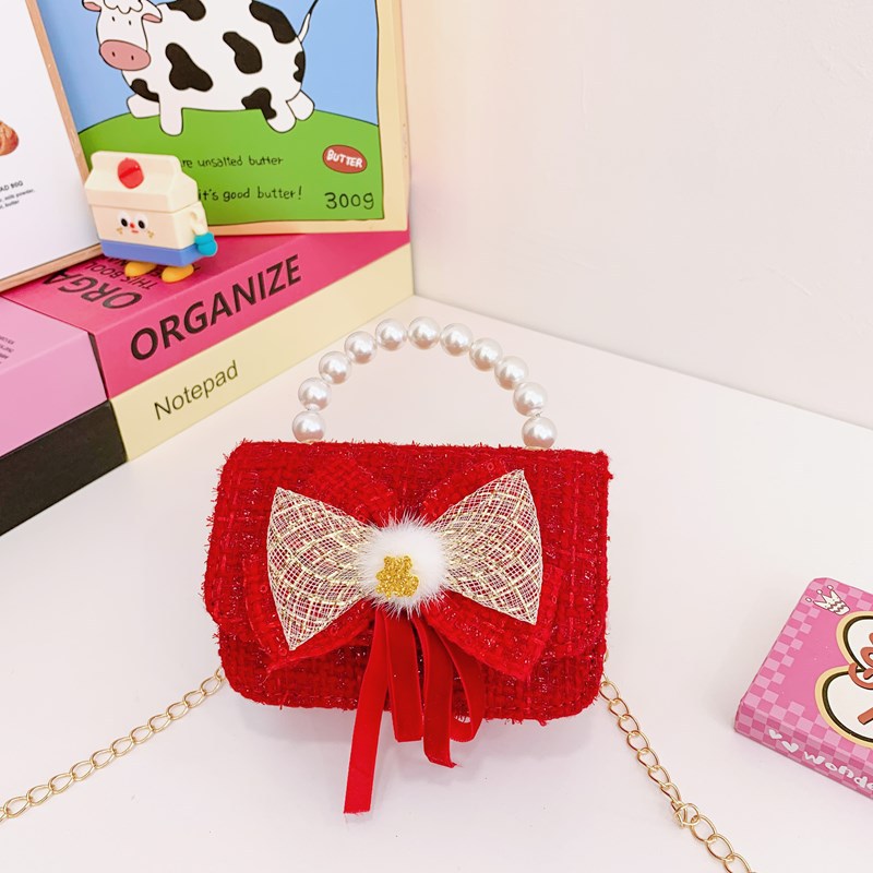 Nuevo bolso de hombro de niñas lindo arco bolso de perla bebé 2025 bolso rojo pequeño viento perfumado bolso para niños