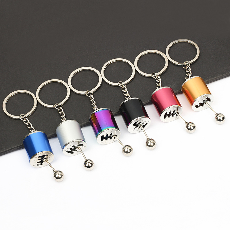 Transfronterizo al por mayor modificación del coche llavero velocidad y pasión clave colgante del coche de los hombres Metal Gear llavero