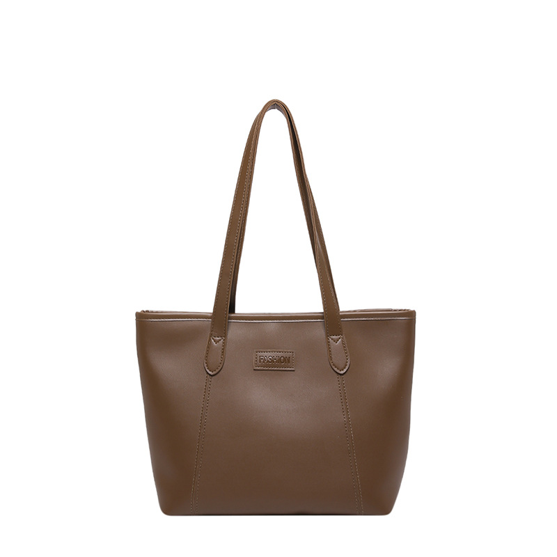 Bolsa de otoño y invierno 2024 nueva bolsa de mujer de viaje de gran capacidad, bolso de hombro de viento simple, bolso de brazo de empalme simple