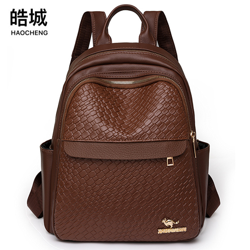 Comercio exterior al por mayor 2023 nueva mochila de PU para mujer coreana simple y versátil mochila de viaje al aire libre mochila escolar