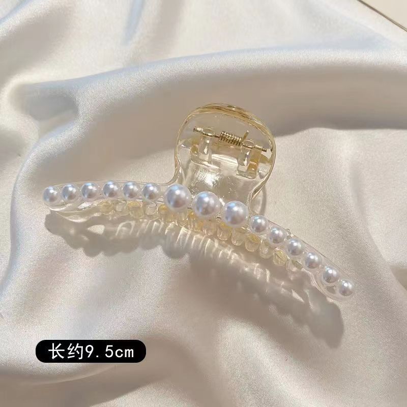 韓国の優雅な気質のサメのクリップの髪をつかみます。