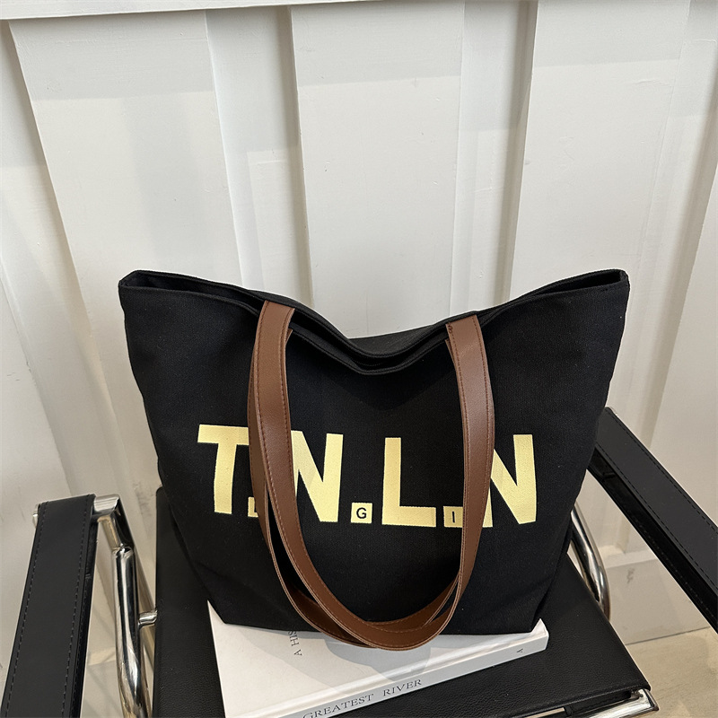Bolsa de lona de gran capacidad para mujeres 2025, primavera y otoño, nueva literatura y moda, bolso de hombro, letras casuales, bolso de viaje