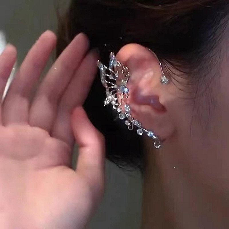 Tiktok mismo estilo mariposa percha de oreja diseño de nicho femenino versátil súper Hada colgador de oreja elfo incrustado en diamante sin clip de hueso de oreja perforado