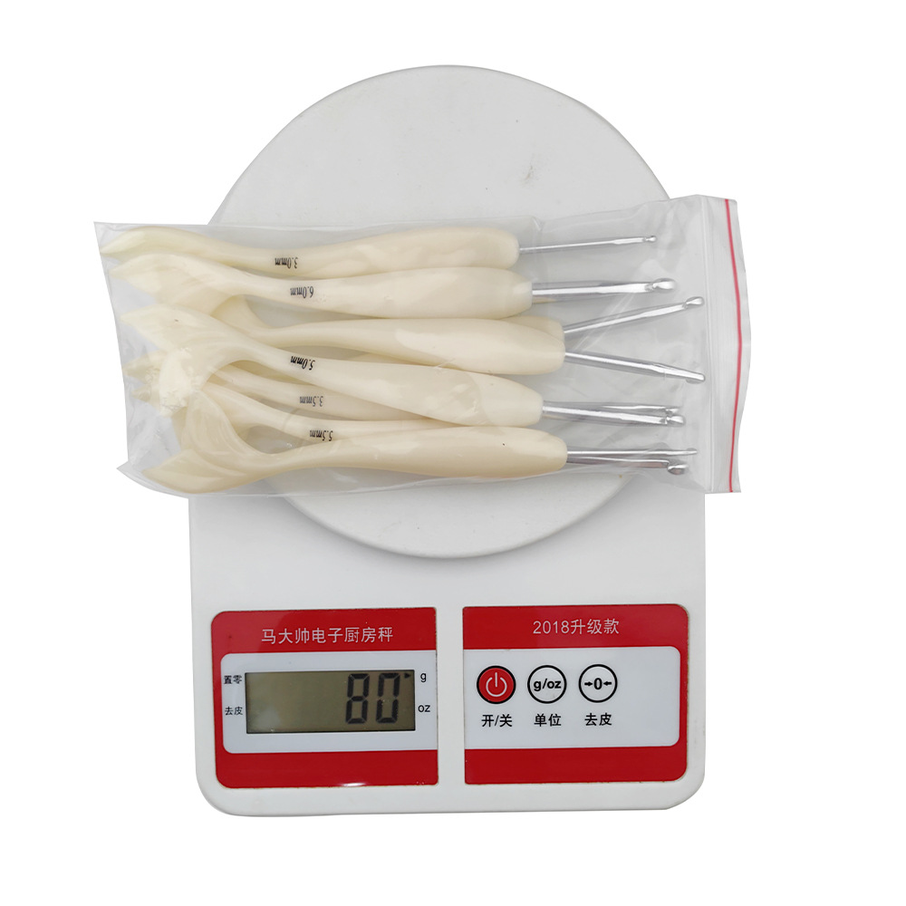 Agujas de suéter transfronterizas resina ABS lisa de cola de pescado de óxido de aluminio de aluminio conjunto de herramientas de gancho de aguja 8 un conjunto