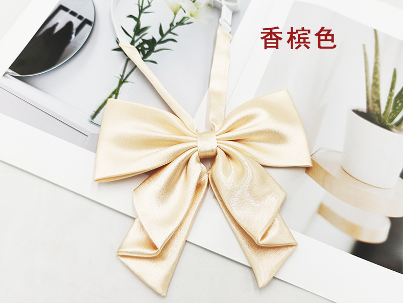 Spot al por mayor color sólido superficie brillante vino negro cuello rojo flor femenino estilo universitario nuevo estilo cola de golondrina plegable pajarita de raíz de pluma grande