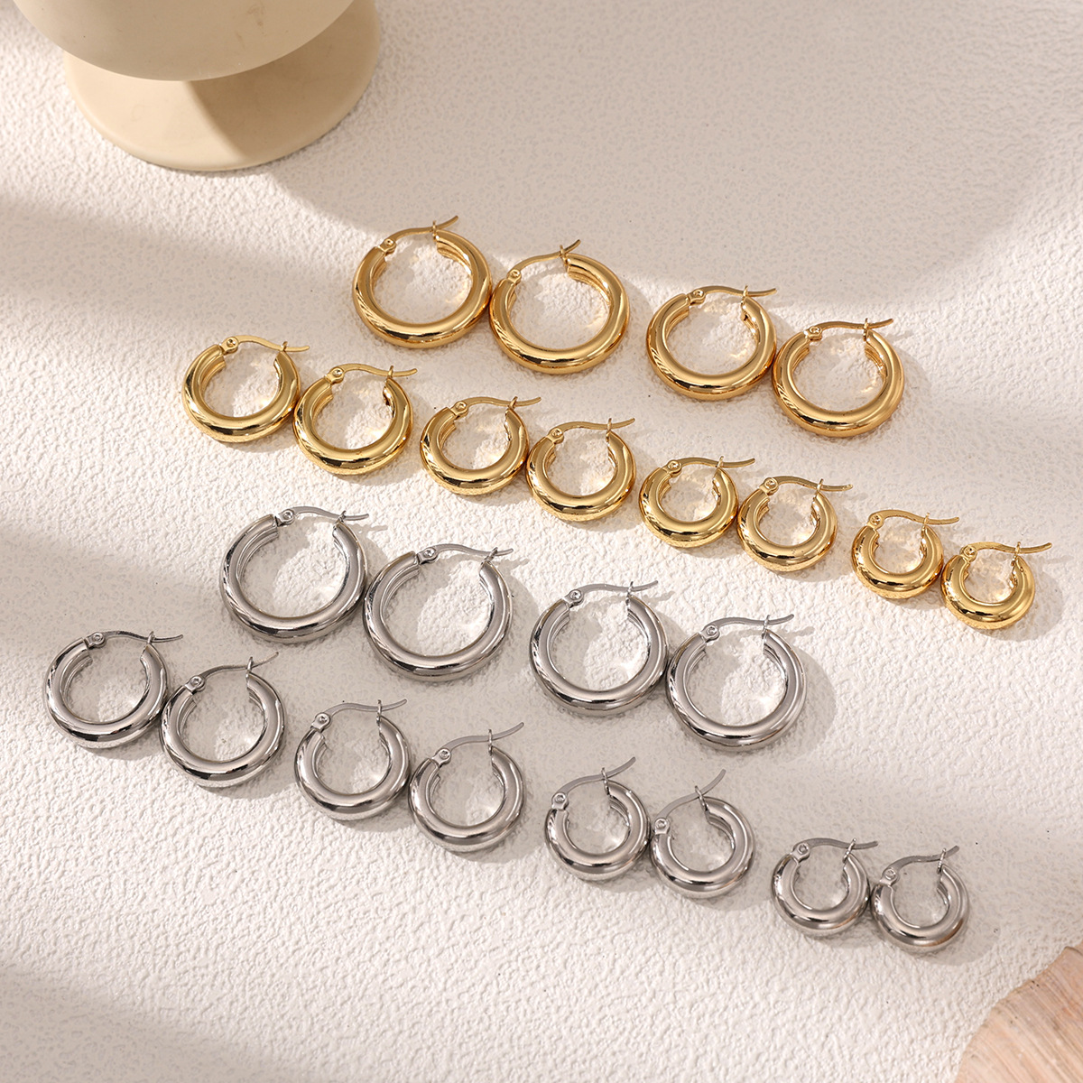 Taina europa y americana pendientes de acero inoxidable nicho de alta calidad estilo anillo personalidad oro y plata de doble color joyas de acero de titanio