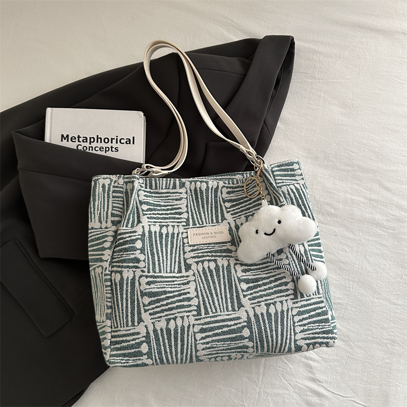 Bolso a rayas casual de todos los partidos de nicho para mujer 2024 nuevo bolso de hombro de gran capacidad de moda retro bolso de viaje