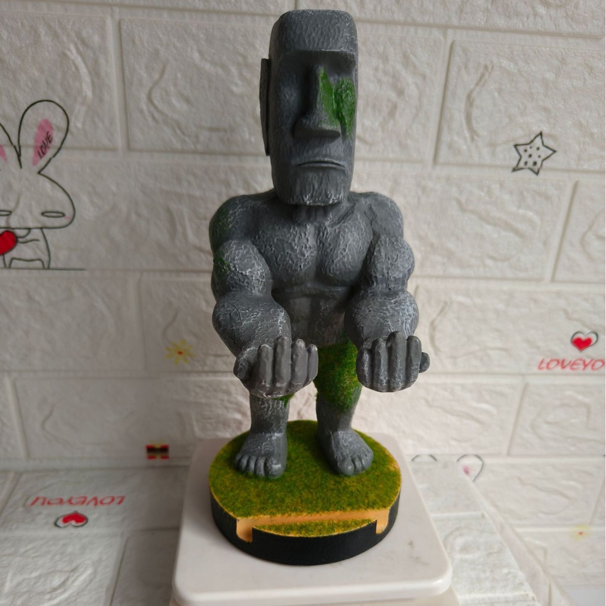 Stone Man Moai game handle bracket muscle man mobile phone bracket stone statue wild man mobile phone holder resin craft