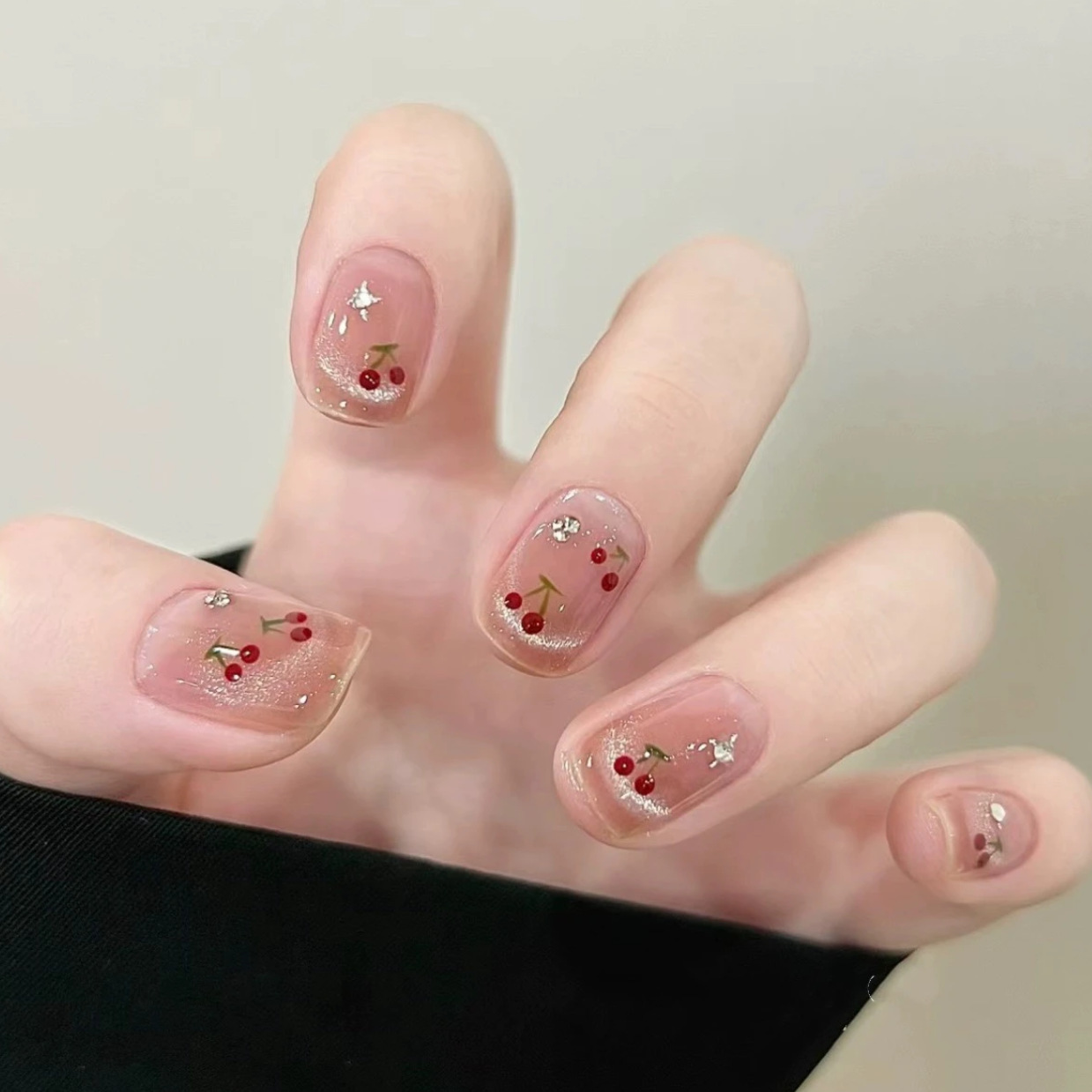 Nuevos productos de primavera y verano, ojos de gato, uñas de vestir de cereza francesa, blanco, corto, lindo parche de uñas de cereza tridimensional, uñas