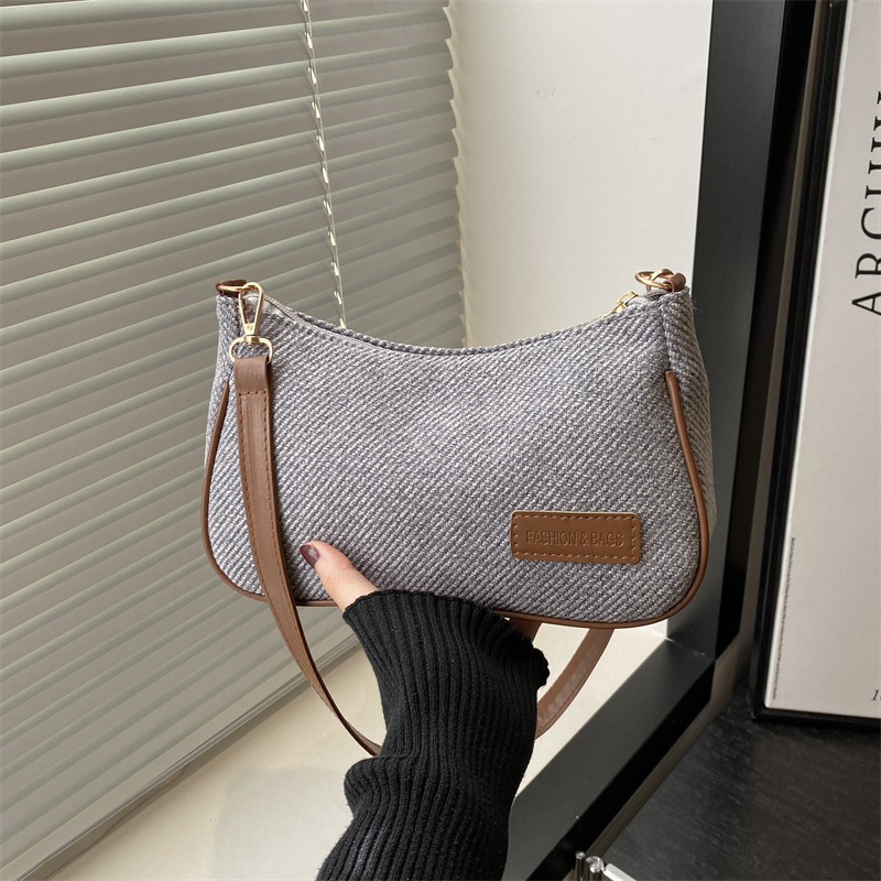 Elegante y simple temperamento nicho bolso de hombro casual 2025 primavera nuevo bolso de mochila de mujer versión coreana bolso popular